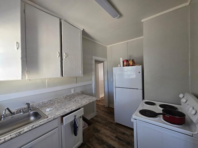 kitchen featuring white appliances, dark wood-type flooring, a sink, white cabinetry, and light countertops