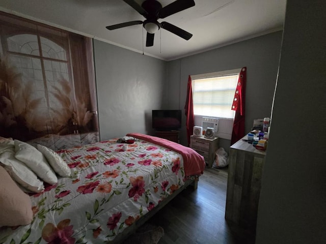 bedroom with cooling unit, a ceiling fan, crown molding, and wood finished floors