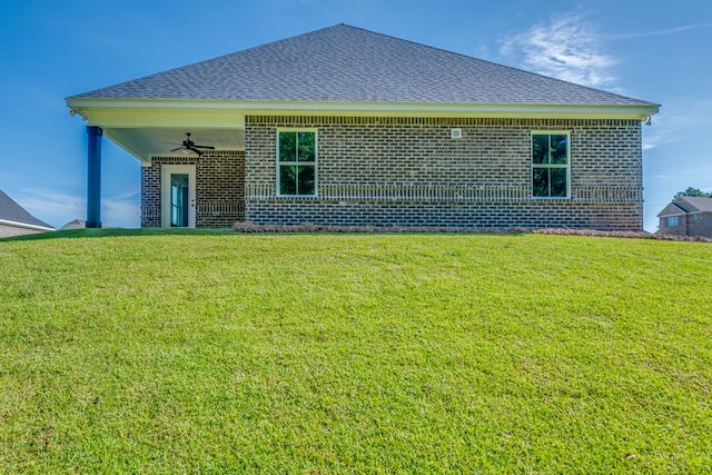 103 Cleo Ct, Enterprise, AL 36330 - rear view of house with brick siding, a ceiling fan, and a lawn