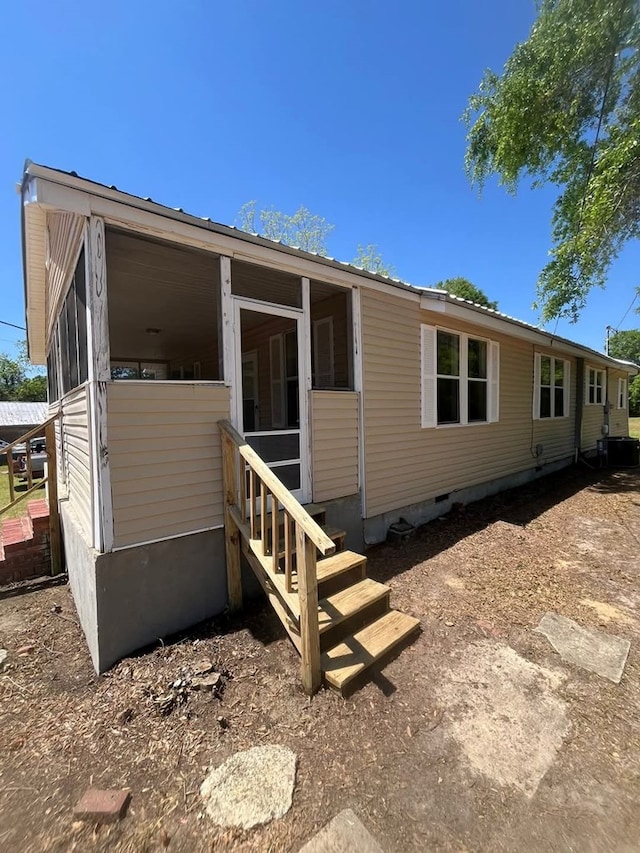 307 Rockhill Cir, Abbeville, AL 36310 - manufactured / mobile home featuring cooling unit, crawl space, a sunroom, and entry steps