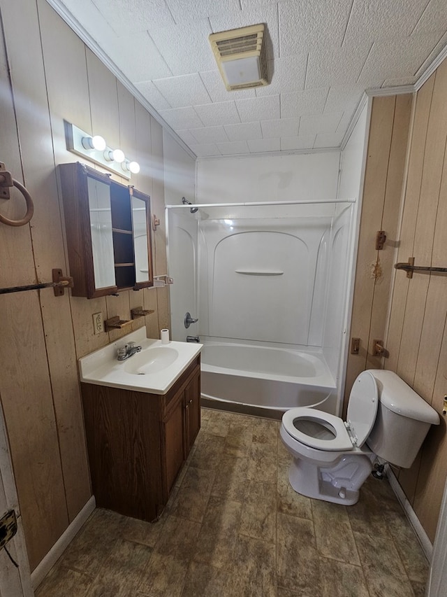 307 Rockhill Cir, Abbeville, AL 36310 - full bathroom featuring vanity, shower / tub combination, visible vents, toilet, and wooden walls