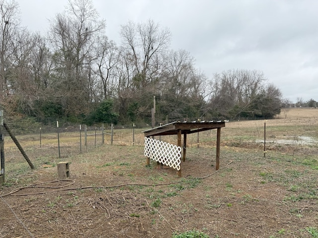 view of yard with a rural view