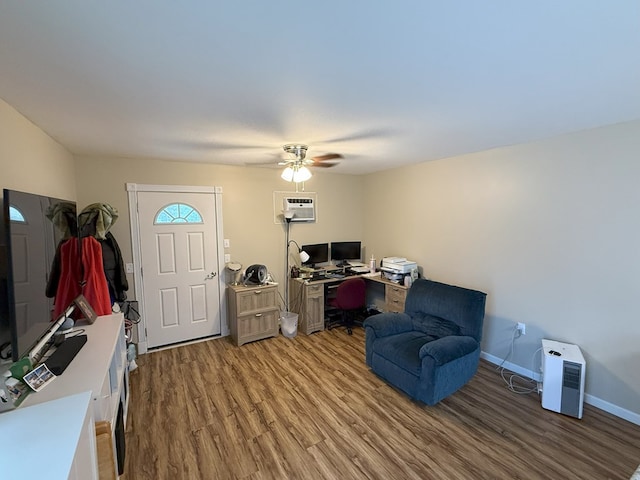 interior space featuring ceiling fan, wood-type flooring, and a wall unit AC