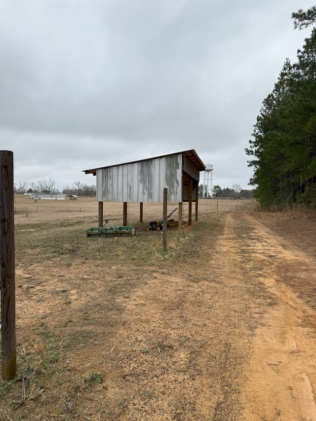 view of outdoor structure featuring a rural view