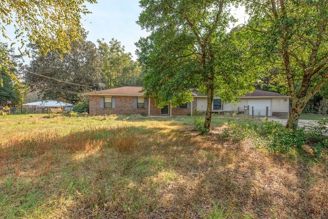 single story home featuring a garage