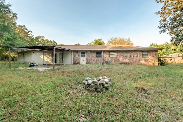 rear view of property featuring french doors