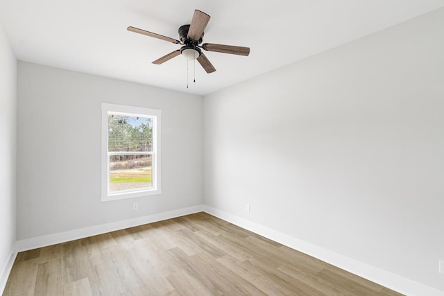 empty room featuring ceiling fan and light hardwood / wood-style flooring