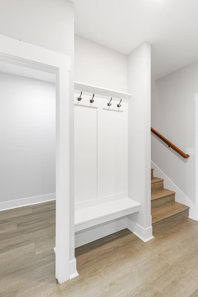 mudroom with light hardwood / wood-style floors