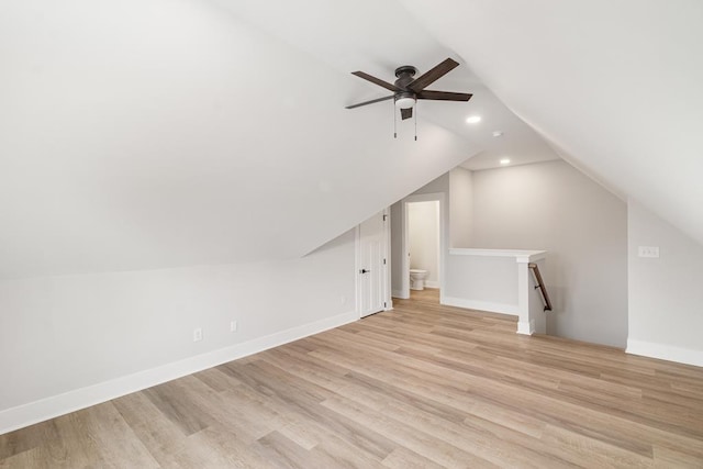 bonus room with ceiling fan, lofted ceiling, and light wood-type flooring