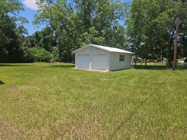 901 Grove St, Cottonwood, AL 36320 - view of grassy yard with a detached garage and an outbuilding