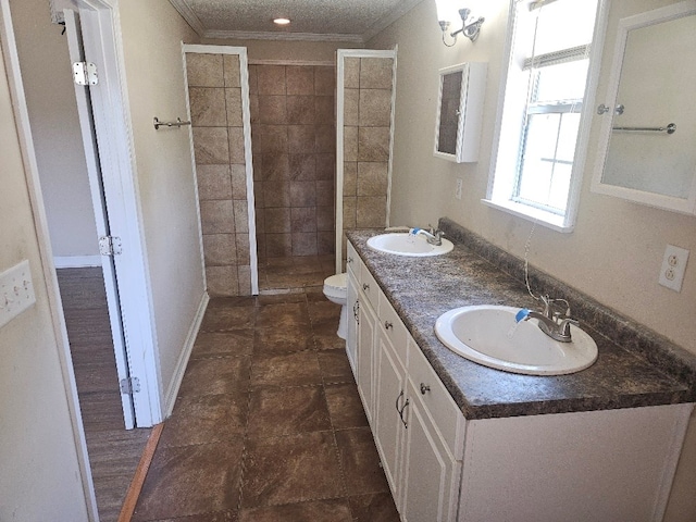 901 Grove St, Cottonwood, AL 36320 - full bathroom with crown molding, a tile shower, and double vanity