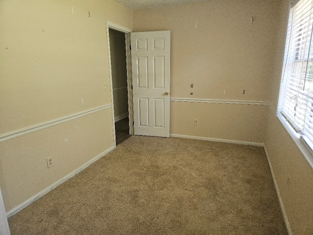 901 Grove St, Cottonwood, AL 36320 - carpeted empty room with baseboards