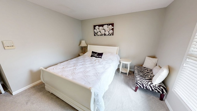 bedroom featuring carpet floors and baseboards