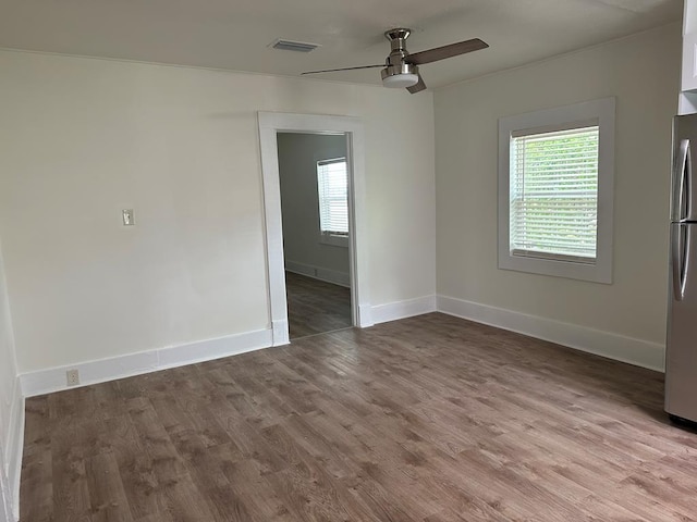 spare room with light hardwood / wood-style floors, plenty of natural light, and ceiling fan