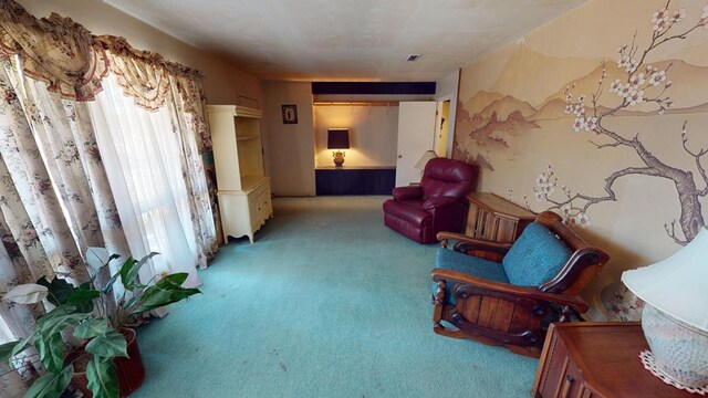 living area featuring light colored carpet and visible vents