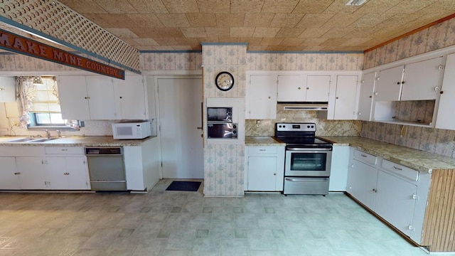 kitchen featuring light countertops, under cabinet range hood, stainless steel electric range oven, dishwashing machine, and white microwave