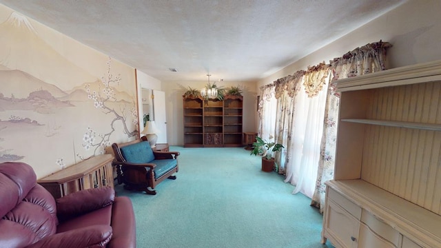living area with a textured ceiling, carpet, and an inviting chandelier