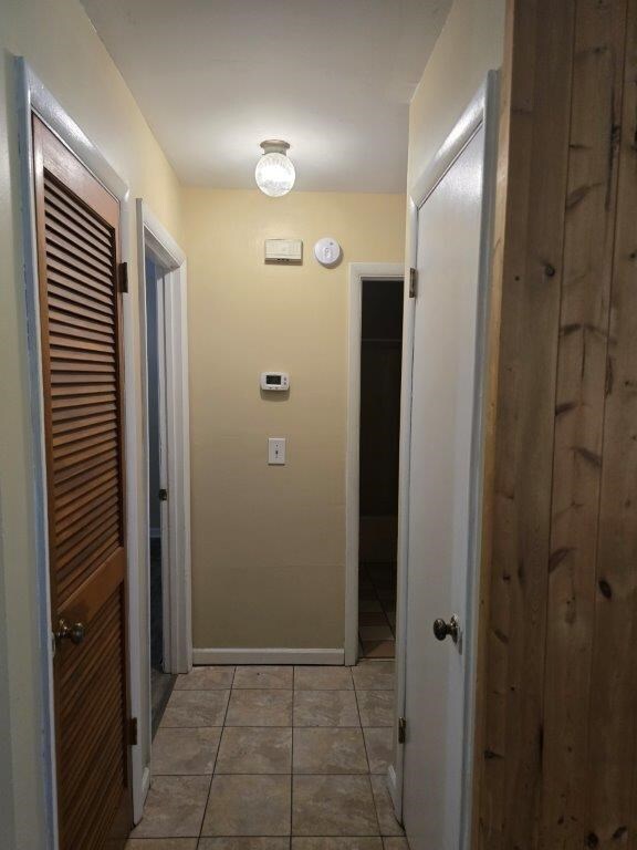 826 Old Newton Rd, Daleville, AL 36322 - hallway with baseboards and light tile patterned flooring