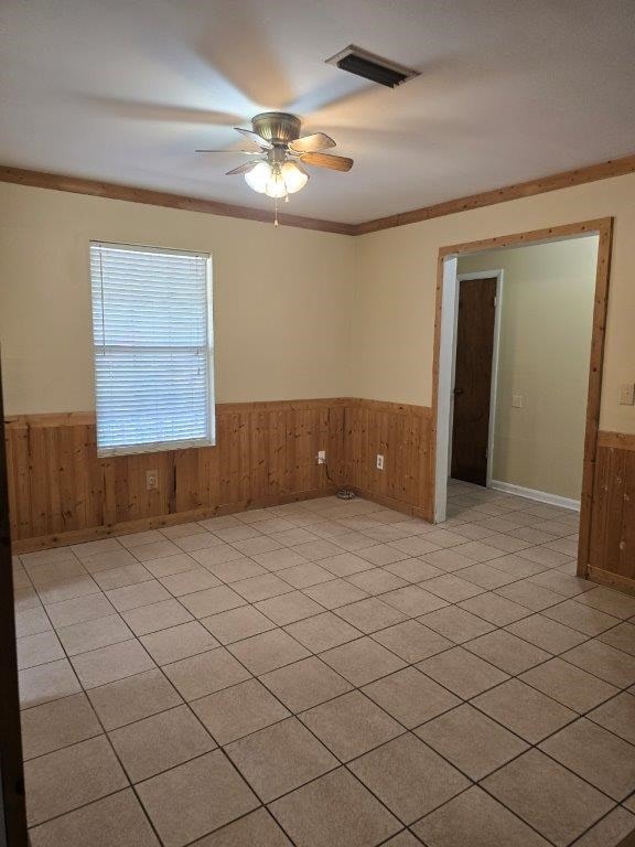 826 Old Newton Rd, Daleville, AL 36322 - spare room with wainscoting, wooden walls, ceiling fan, and ornamental molding