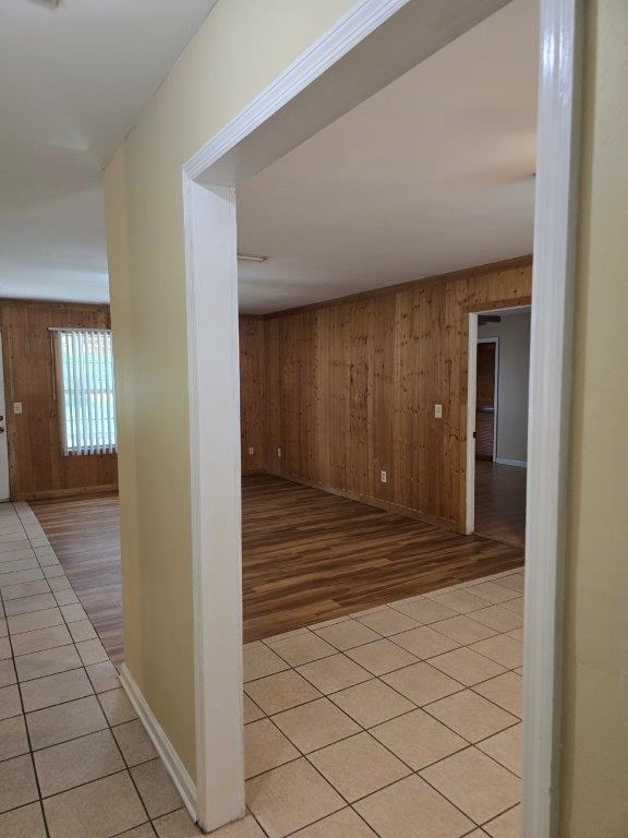 826 Old Newton Rd, Daleville, AL 36322 - hallway featuring wood walls, light wood-style floors, and baseboards