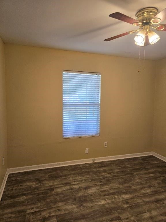 826 Old Newton Rd, Daleville, AL 36322 - spare room featuring dark wood-type flooring, a ceiling fan, and baseboards