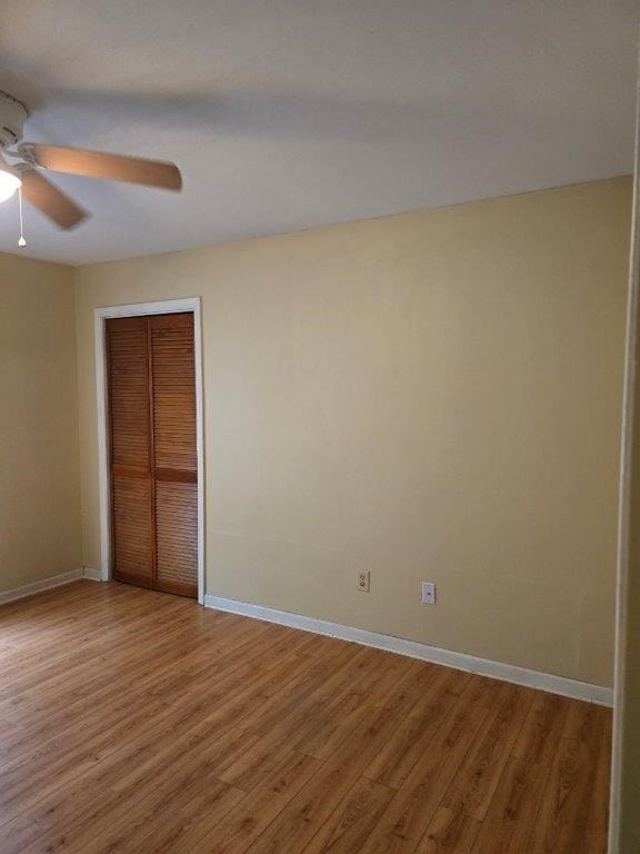 826 Old Newton Rd, Daleville, AL 36322 - unfurnished bedroom featuring light wood-style floors, baseboards, a closet, and ceiling fan