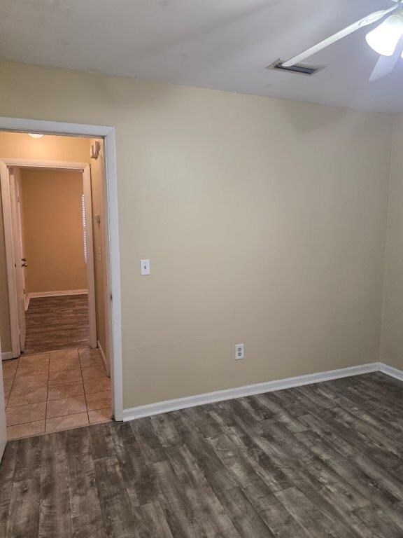 826 Old Newton Rd, Daleville, AL 36322 - spare room with dark wood-style floors, baseboards, and ceiling fan