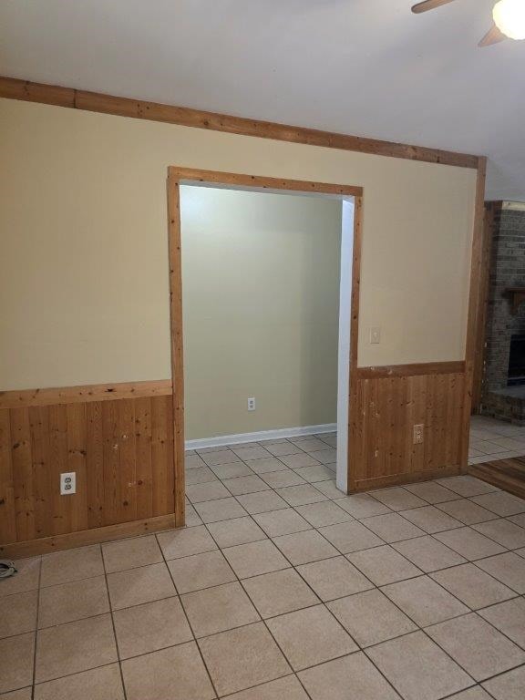 826 Old Newton Rd, Daleville, AL 36322 - spare room with a wainscoted wall, wooden walls, and ceiling fan