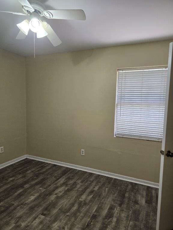 826 Old Newton Rd, Daleville, AL 36322 - unfurnished room with dark wood finished floors, baseboards, and a ceiling fan