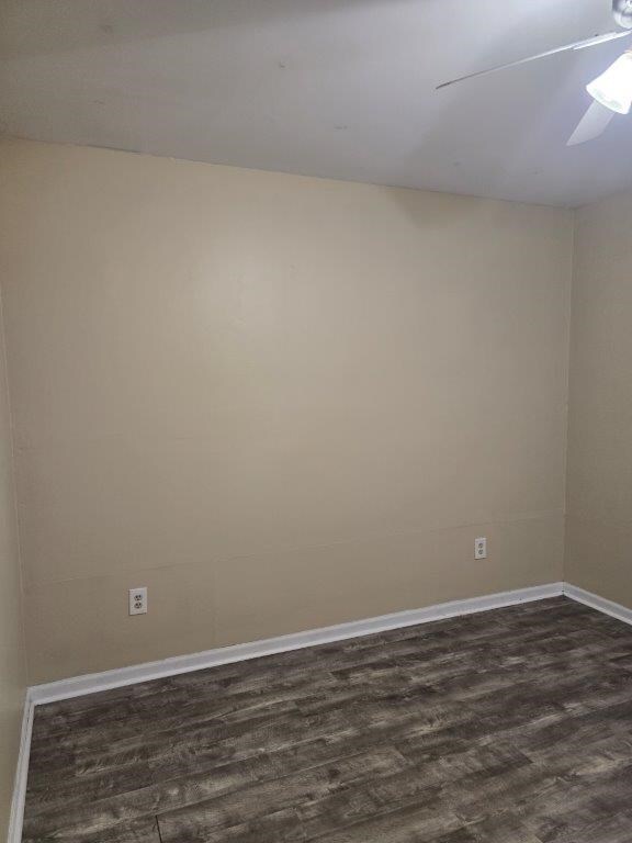 826 Old Newton Rd, Daleville, AL 36322 - empty room with dark wood finished floors, baseboards, and ceiling fan