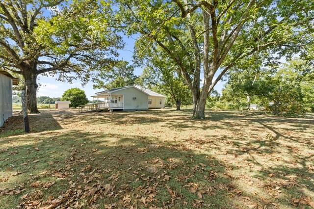 view of yard featuring a wooden deck