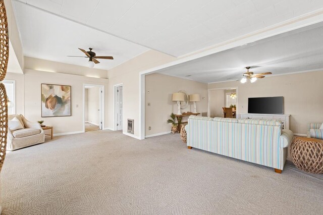 carpeted living room featuring ceiling fan