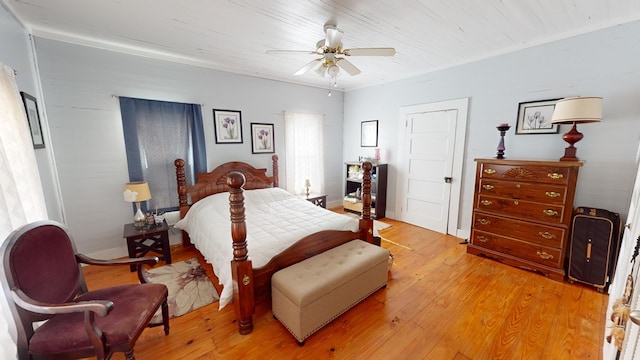 bedroom featuring light wood-type flooring, wood ceiling, and a ceiling fan