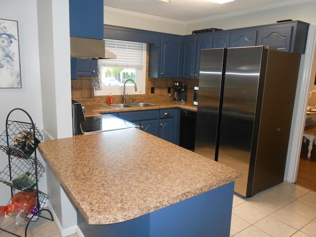 363 Vining Dr, Dothan, AL 36305 - kitchen with freestanding refrigerator, a sink, blue cabinets, stove, and light tile patterned flooring