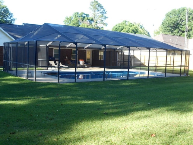 363 Vining Dr, Dothan, AL 36305 - swimming pool with a yard, a patio, and glass enclosure