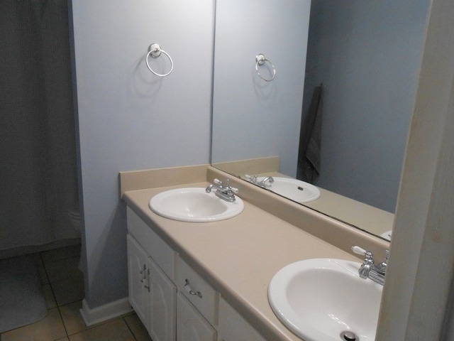 363 Vining Dr, Dothan, AL 36305 - full bath with tile patterned flooring, toilet, and double vanity