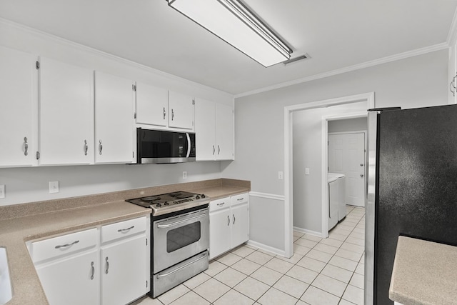 kitchen with visible vents, white cabinets, appliances with stainless steel finishes, and ornamental molding