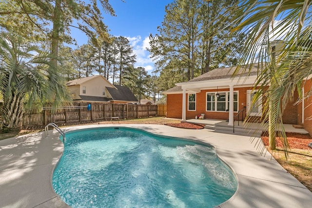 view of pool featuring a patio area, a fenced in pool, and fence