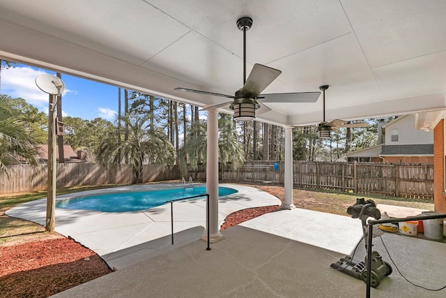 view of pool featuring a fenced backyard, a fenced in pool, a patio, and ceiling fan