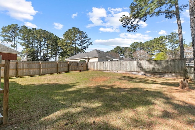 view of yard with a fenced backyard