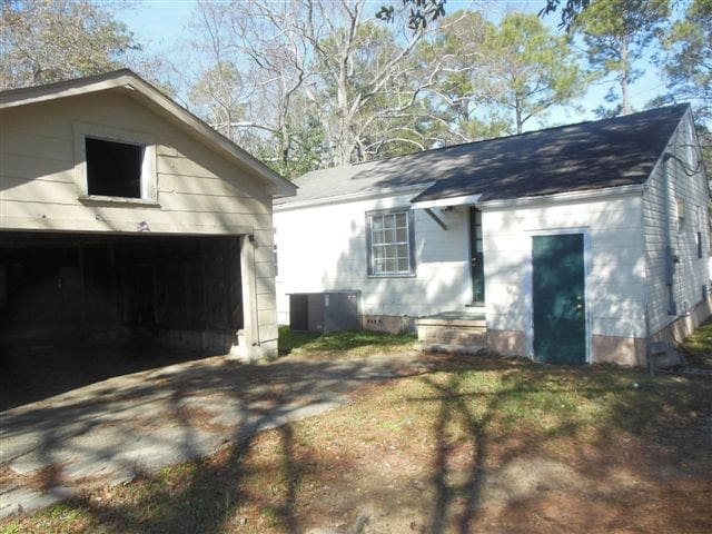 view of side of property featuring a garage