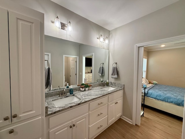 103 Neenan Dr, Enterprise, AL 36330 - ensuite bathroom with double vanity, wood finished floors, toilet, and baseboards
