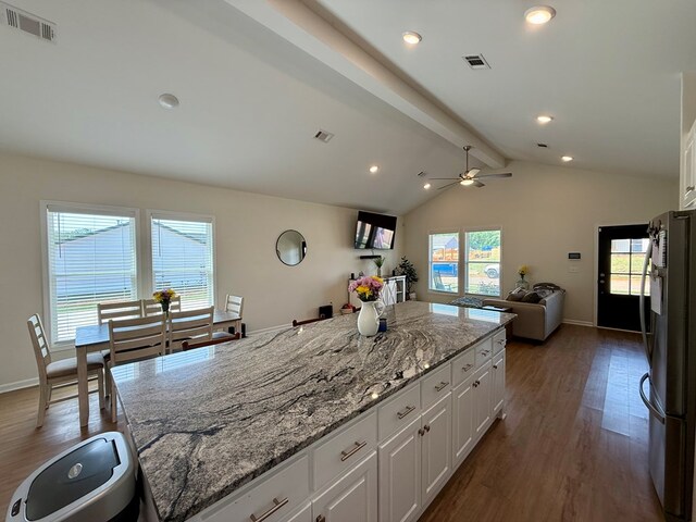 103 Neenan Dr, Enterprise, AL 36330 - kitchen with freestanding refrigerator, dark wood-style flooring, plenty of natural light, white cabinets, and recessed lighting