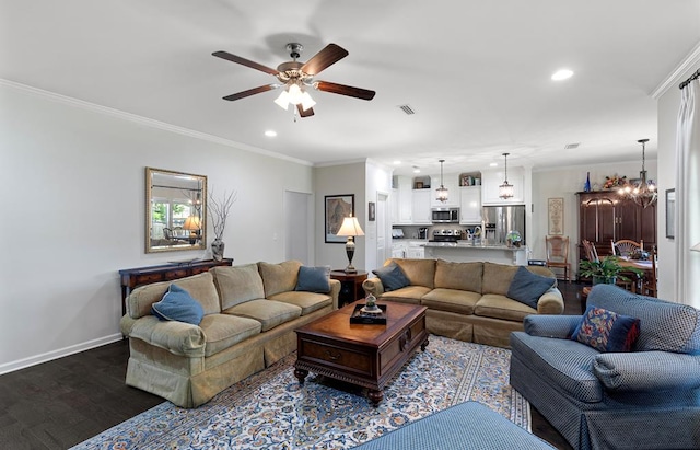 living room featuring ceiling fan with notable chandelier, dark hardwood / wood-style flooring, and ornamental molding