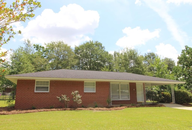 1125 Garden Ln, Dothan, AL 36301 - single story home with concrete driveway, a carport, a front yard, and brick siding
