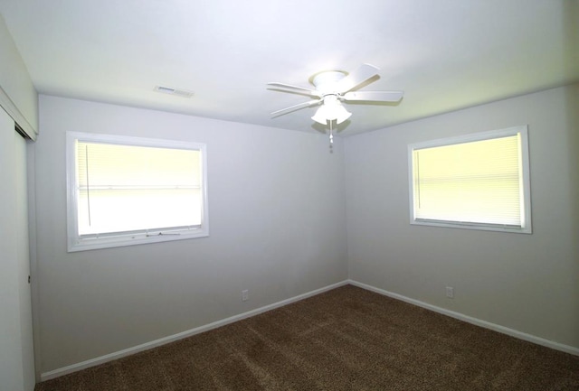 1125 Garden Ln, Dothan, AL 36301 - empty room with ceiling fan and dark carpet