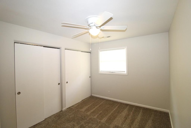 1125 Garden Ln, Dothan, AL 36301 - unfurnished bedroom with multiple closets, carpet, and a ceiling fan