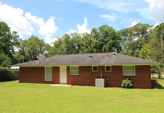 1125 Garden Ln, Dothan, AL 36301 - back of property featuring a yard, brick siding, and a shingled roof
