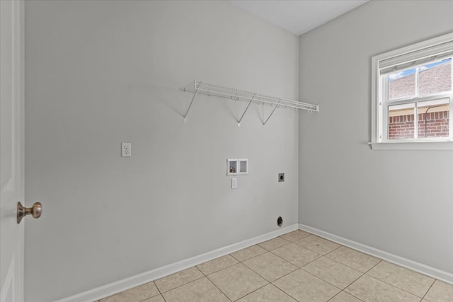 clothes washing area with hookup for an electric dryer, light tile patterned floors, and hookup for a washing machine