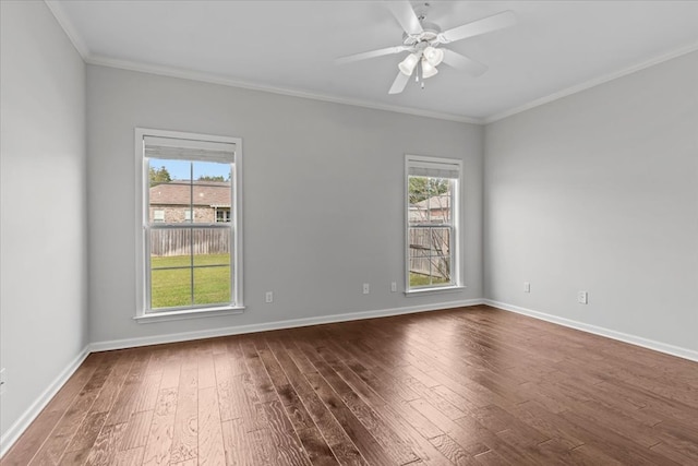 unfurnished room with wood-type flooring, a wealth of natural light, ornamental molding, and ceiling fan